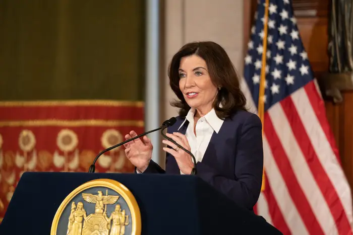 New York Governor Kathy Hochul speaks at a podium during a virtual announcement on the state's COVID-19 guidelines.